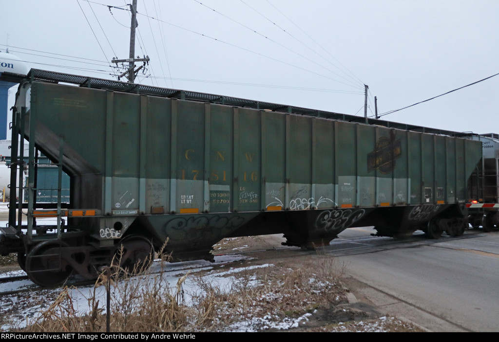 CNW 178116 pauses in front of me as the train stops to line the switch onto the Harvard Sub main